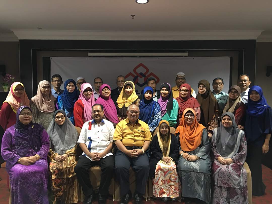 Ruziah (third from right) is an active motivational speaker, trainer, and consultant.